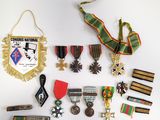 many medals and medals on display on a white surface