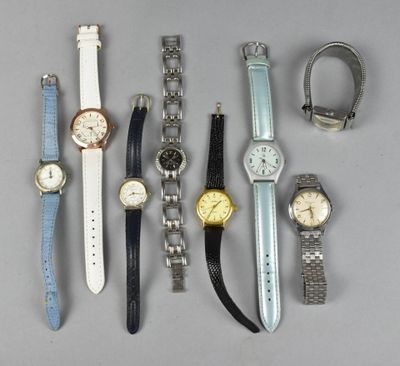 a lot of watches that are sitting on a table