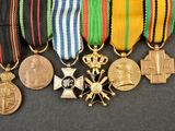 many medals and medals on a black surface