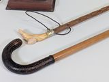 two canes and a book on a table