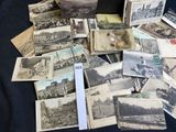 a lot of old photos on the table together