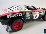 a model of a race car on a white surface