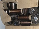 many spools of thread sitting in a box