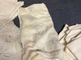 a pile of clothing that is laying on a table
