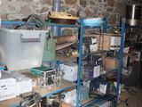 a room that has a bunch of items on the shelves