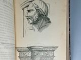 an open book with a drawing of a man in a turban on top of it