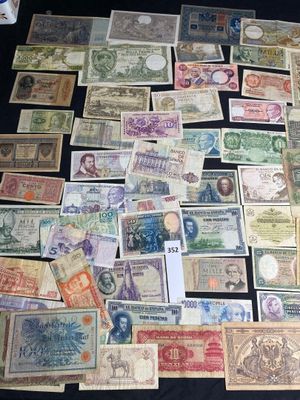many different types of paper money on the table