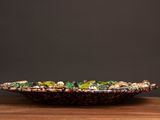 a close up of a bowl on a wooden table