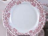 many plates stacked on top of each other on a table
