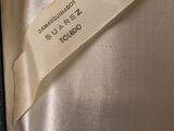 a close up of a tie with a label on it