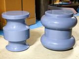 two blue stools sitting next to each other on a counter
