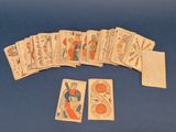 a lot of playing cards on a blue table