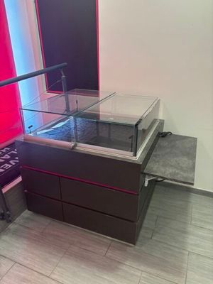 a display case with a glass top in a room