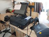 a desk with a computer and a printer on top of it