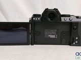 a camera that is sitting on a table next to a monitor
