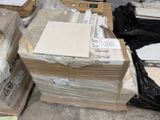 a lot of boxes and boxes of items on the floor