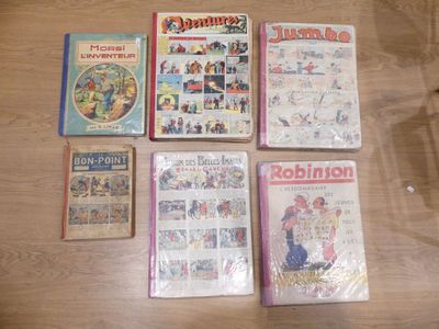 plusieurs livres pour enfants sont alignés sur une table en bois