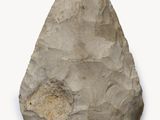 a close up of a stone object on a white surface