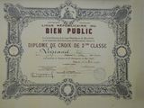 an old certificate with a picture of a man in a suit and tie