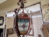 a chandelier hanging from the ceiling in a living room