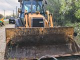 a bulldozer that is sitting in the grass