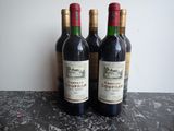 three bottles of wine sitting on top of a table next to each other