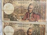 two different bank notes with a picture of a man in a red coat