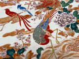 a picture of a table with a bird and flowers on it