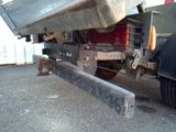 an image of a dump truck parked in a parking lot