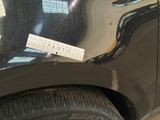 a sticker on the side of a car that has a sticker attached to it