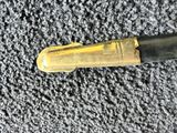 a pen that is laying on top of a carpet