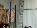 many tires and a ladder in a warehouse area