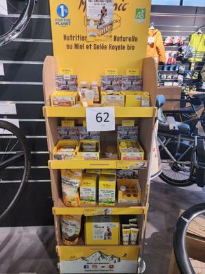 a display of food items in a store with bicycles in the background