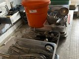 a lot of utensils on the counter in the kitchen