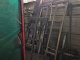 many pieces of wood stacked on top of each other in a room
