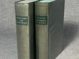 two books sitting on top of a table next to each other