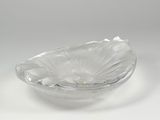a clear glass bowl with a flower inside of it