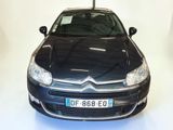 a picture of a black citrole parked in a white room