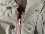 a close up of a jacket with a zipper on it