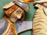 a figurine of a man and a horse on a table