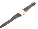 an image of a wrist watch on a white surface with a white background