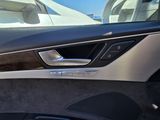 a close up of a car door handle with the door handle open