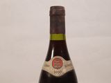 a bottle of wine that is sitting on a table