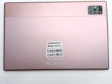 the back of a pink laptop with a bar code on it