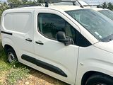 a white van that is parked on the side of the road