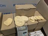 a box of cookies sitting on top of a table next to a box of cookies