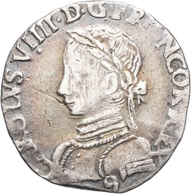 une pièce d'argent sur laquelle figure l'effigie d'un homme coiffé d'un chapeau