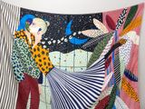 an image of a tapestry hanging on a wall