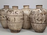three vases that are sitting on a white surface