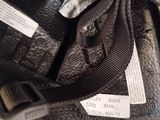 a close up of a pair of shoes with a tag on them